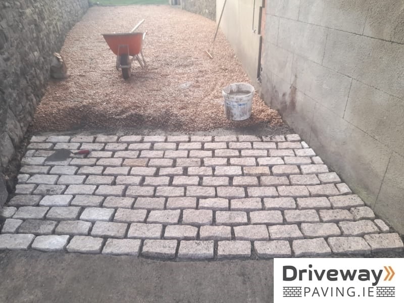 Gravel driveway with granite setts